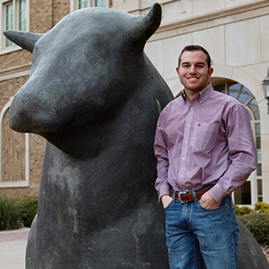 Tyler and Statue of a Bull